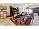 Cozy living room with large TV, comfortable seating, and view of backyard at 236 Barrington Dr, Haines City, FL 33844