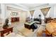 Cozy living room with tile floors, neutral colors, stylish decor and plenty of natural light at 236 Barrington Dr, Haines City, FL 33844
