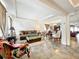Bright and airy living room with open layout, tile flooring, and an abundance of natural light at 236 Barrington Dr, Haines City, FL 33844