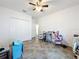 Bright room with tile floors, ceiling fan, closet, and medical equipment at 236 Barrington Dr, Haines City, FL 33844