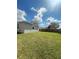 Spacious backyard featuring a large, well-maintained lawn and a sturdy wooden fence for privacy at 388 Chinaberry Ave, Oviedo, FL 32765