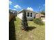 Well-maintained home with a tidy lawn and a sturdy wooden fence for added privacy at 388 Chinaberry Ave, Oviedo, FL 32765