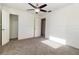 Spacious bedroom with ceiling fan and carpet flooring at 4970 Turnbull Dr, Orlando, FL 32812