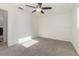 Bright bedroom with ceiling fan and carpet flooring at 4970 Turnbull Dr, Orlando, FL 32812