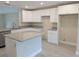 Modern kitchen featuring white cabinets and granite countertops at 6929 Central Ave, Mulberry, FL 33860