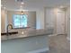 Open kitchen with granite countertops and island at 6929 Central Ave, Mulberry, FL 33860