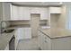 Modern kitchen with white cabinets and granite island at 6929 Central Ave, Mulberry, FL 33860