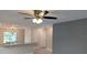 Bright living room with ceiling fan and view to kitchen at 6929 Central Ave, Mulberry, FL 33860