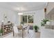 Bright dining area with sliding glass doors and a modern light fixture at 707 Beverly Ave, Altamonte Springs, FL 32701