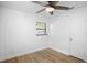 Bright bedroom featuring wood-look floors, a ceiling fan, and a window at 1621 Puritan Ave, Winter Park, FL 32792