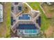 An aerial view showcasing the home's solar panels and pool at 1772 Sparkling Water Cir, Ocoee, FL 34761