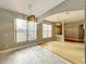 Bright dining room with hardwood floors and stylish light fixture at 1772 Sparkling Water Cir, Ocoee, FL 34761