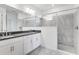 Bathroom featuring double vanity, and a glass-enclosed tiled shower at 4723 Coral Harbour Rd, Kissimmee, FL 34758