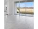 Open living space showcasing tile flooring and large windows with a beautiful waterfront view at 4723 Coral Harbour Rd, Kissimmee, FL 34758
