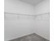 Walk-in closet with ample shelving offering organized storage solutions at 4723 Coral Harbour Rd, Kissimmee, FL 34758