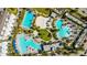 A fantastic aerial view of the community pool area with several different pools to choose from and enjoy at 8279 Nemours Pkwy, Orlando, FL 32827