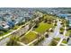 Expansive aerial view of a well-planned community with green spaces and tree-lined streets at 8279 Nemours Pkwy, Orlando, FL 32827