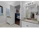 Bathroom featuring granite countertops, white cabinets, and a seamless glass shower at 8279 Nemours Pkwy, Orlando, FL 32827