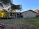 Home's backyard with deck and grassy area at 910 Rangeline Rd, Longwood, FL 32750