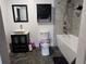 Updated bathroom with new vanity, toilet, and bathtub at 910 Rangeline Rd, Longwood, FL 32750