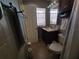 Bathroom with toilet, sink, and shower at 910 Rangeline Rd, Longwood, FL 32750