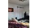 Relaxing bedroom with barn door, comfy seating and large painting at 910 Rangeline Rd, Longwood, FL 32750