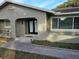 House exterior boasts a modern double door entry and well-manicured landscaping at 910 Rangeline Rd, Longwood, FL 32750