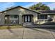 House exterior boasts a modern double door entry and well-manicured landscaping at 910 Rangeline Rd, Longwood, FL 32750