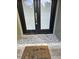 Modern double front doors with a pebble stone entryway at 910 Rangeline Rd, Longwood, FL 32750