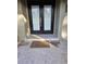 Modern double front doors with a pebble stone entryway at 910 Rangeline Rd, Longwood, FL 32750