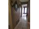 Bright hallway with tile floors leading to other rooms at 910 Rangeline Rd, Longwood, FL 32750