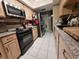 Well-equipped kitchen featuring stainless steel appliances and wood cabinets at 910 Rangeline Rd, Longwood, FL 32750