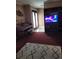 Spacious living room featuring a piano, TV, and comfy seating at 910 Rangeline Rd, Longwood, FL 32750