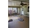 Sunroom with new flooring, ceiling fan, and small table with chairs at 910 Rangeline Rd, Longwood, FL 32750