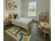 Bright bedroom featuring whimsical decor and a cozy atmosphere at 1202 Alafia Way, Poinciana, FL 34759