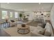Open-concept living space featuring modern furnishings and ample natural light at 1202 Alafia Way, Poinciana, FL 34759