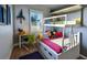 Bright bedroom with built-in bunk beds and playful decor at 1314 Hillsborough Ct, Poinciana, FL 34759