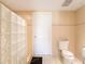 A full bathroom with an enclosed shower and a tiled floor at 3145 Packard Ave, St Cloud, FL 34772
