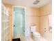 A tiled bathroom features an enclosed shower and a toilet at 3145 Packard Ave, St Cloud, FL 34772