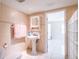 A full bathroom features an enclosed shower, toilet and sink at 3145 Packard Ave, St Cloud, FL 34772