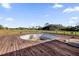 A pool deck overlooks a pasture at 3145 Packard Ave, St Cloud, FL 34772