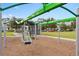 Modern playground swing set overlooking a park with nearby community amenities at 7951 Nemours Pkwy, Orlando, FL 32827