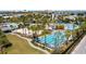 A stunning aerial view features resort-style pools and landscaping at 7951 Nemours Pkwy, Orlando, FL 32827