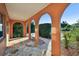 Covered porch with arched entryway and flagstone flooring at 2141 Camellia Dr, Longwood, FL 32779