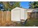 White storage shed in backyard, providing extra storage at 2141 Camellia Dr, Longwood, FL 32779