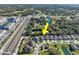 An aerial view highlighting the property's location close to community amenities and a local highway at 3207 Stratton Cir, Kissimmee, FL 34744