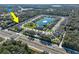 Aerial view of the community with a central lake, beautiful landscaping, and easy access to amenities at 3207 Stratton Cir, Kissimmee, FL 34744
