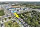 An aerial view reveals the property's location near commercial areas, community park, and local highway at 3207 Stratton Cir, Kissimmee, FL 34744