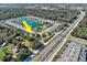 An aerial view shows the property's location near a pond, community park, and local highway at 3207 Stratton Cir, Kissimmee, FL 34744