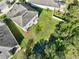 Aerial view of backyard, showing lawn and surrounding trees at 3207 Stratton Cir, Kissimmee, FL 34744